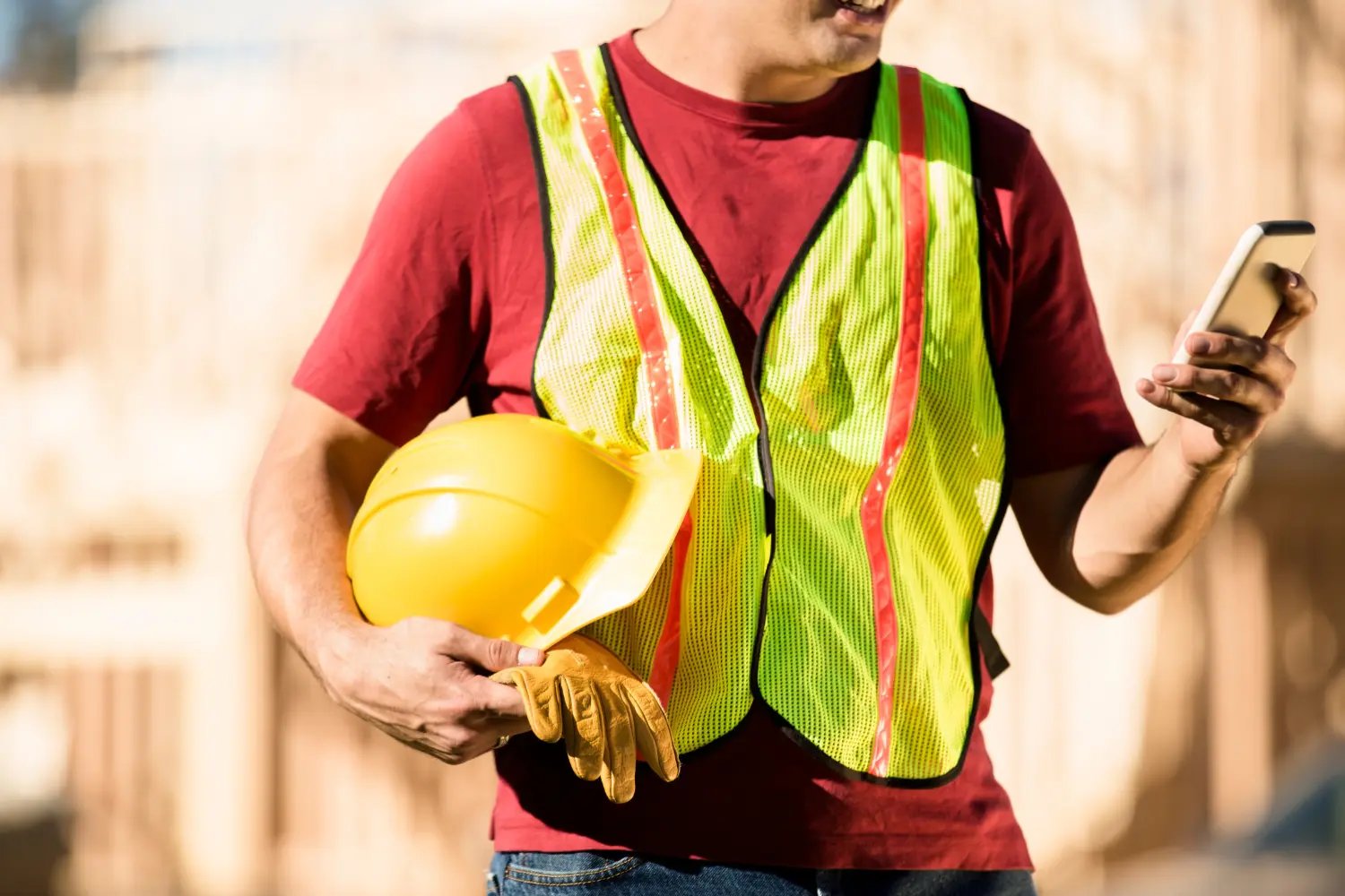 Construction worker on phone using TextHive